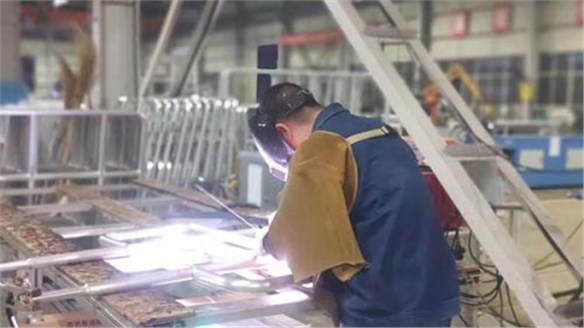 Working overtime and busy with production, working together to ensure progress